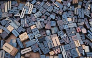 A jumble of old, ink-stained typesetting blocks